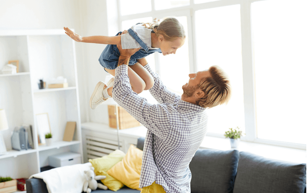 man with child playing